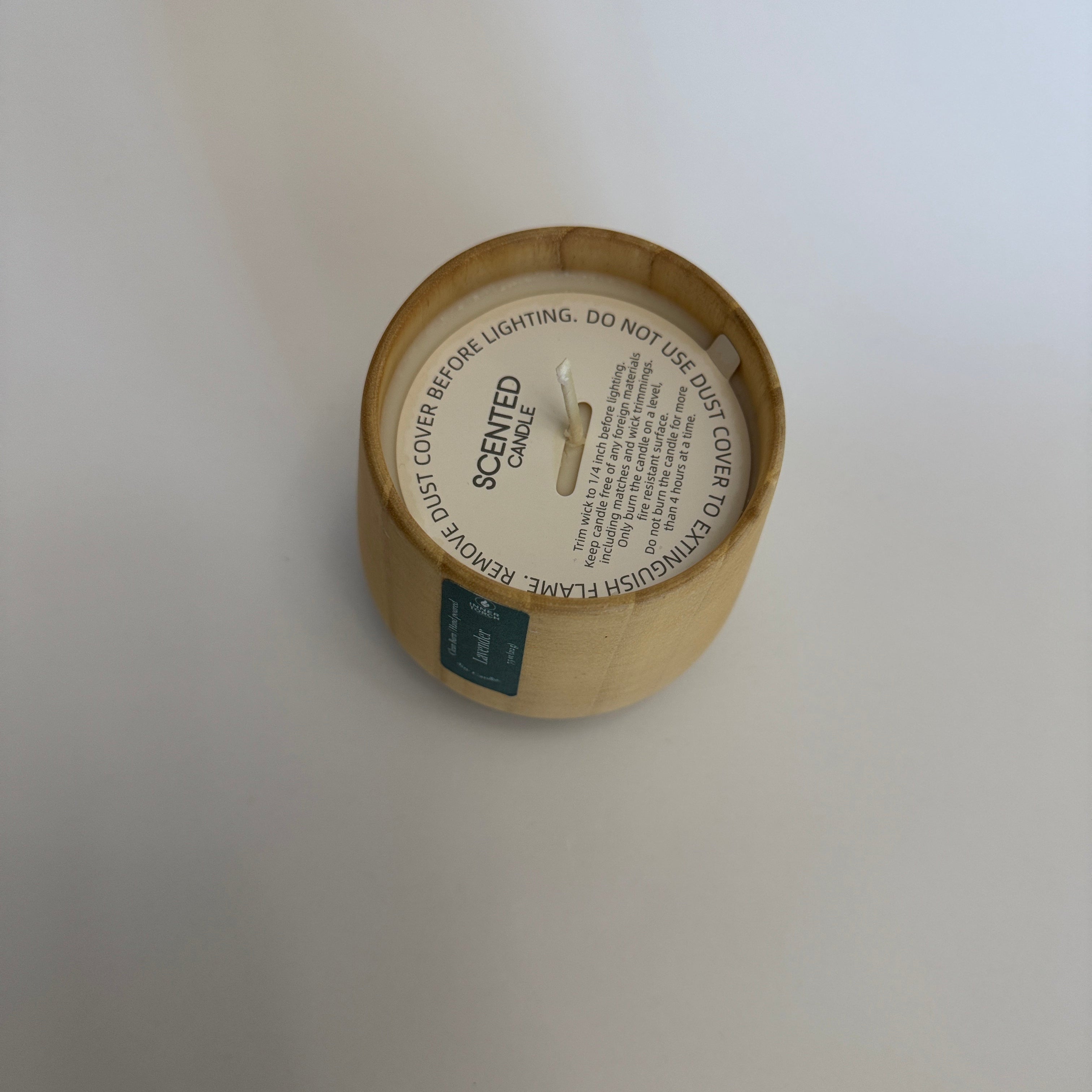 Round cardboard product packaging with a label on a white background